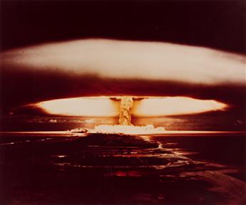 (NULCEAR EXPLOSION) A group of 4 large color photographs depicting various American atomic bomb tests in the 1950s, three at the Nevada